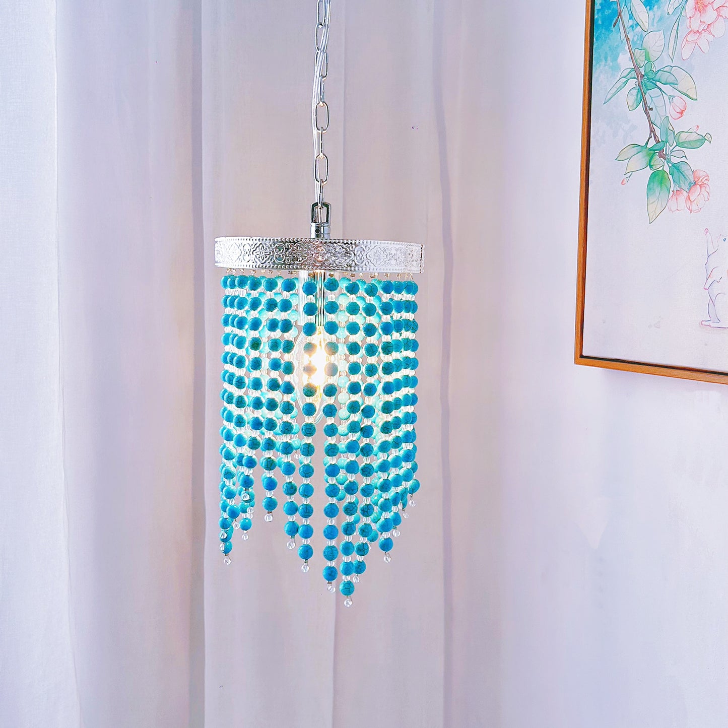 Blue beaded pendant light hanging