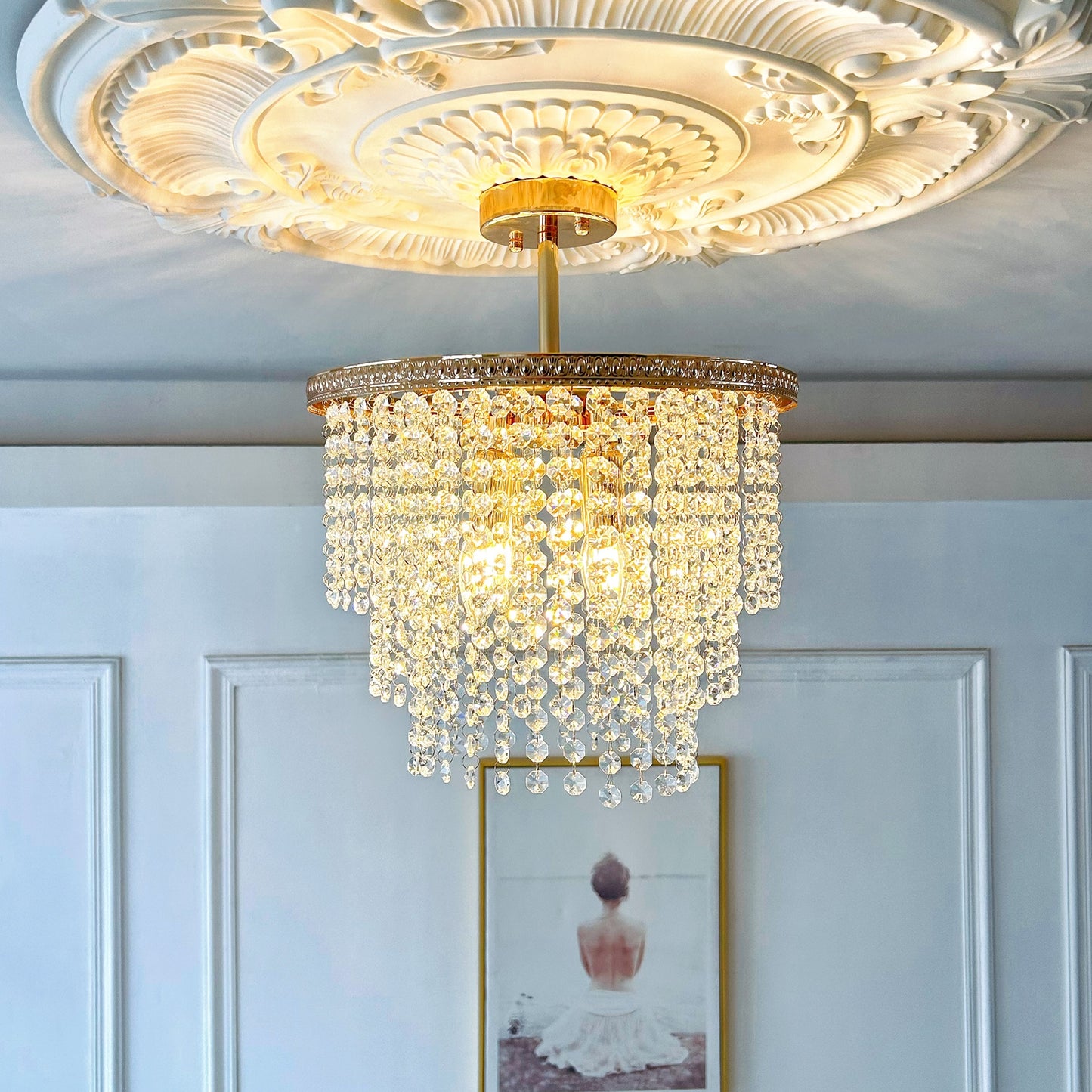 Compact 4 light crystal chandelier close up showing gold finish and sparkling crystals
