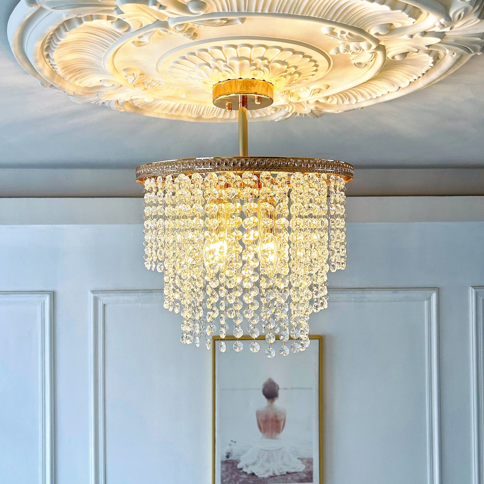 Compact 4 light crystal chandelier close up showing gold finish and sparkling crystals