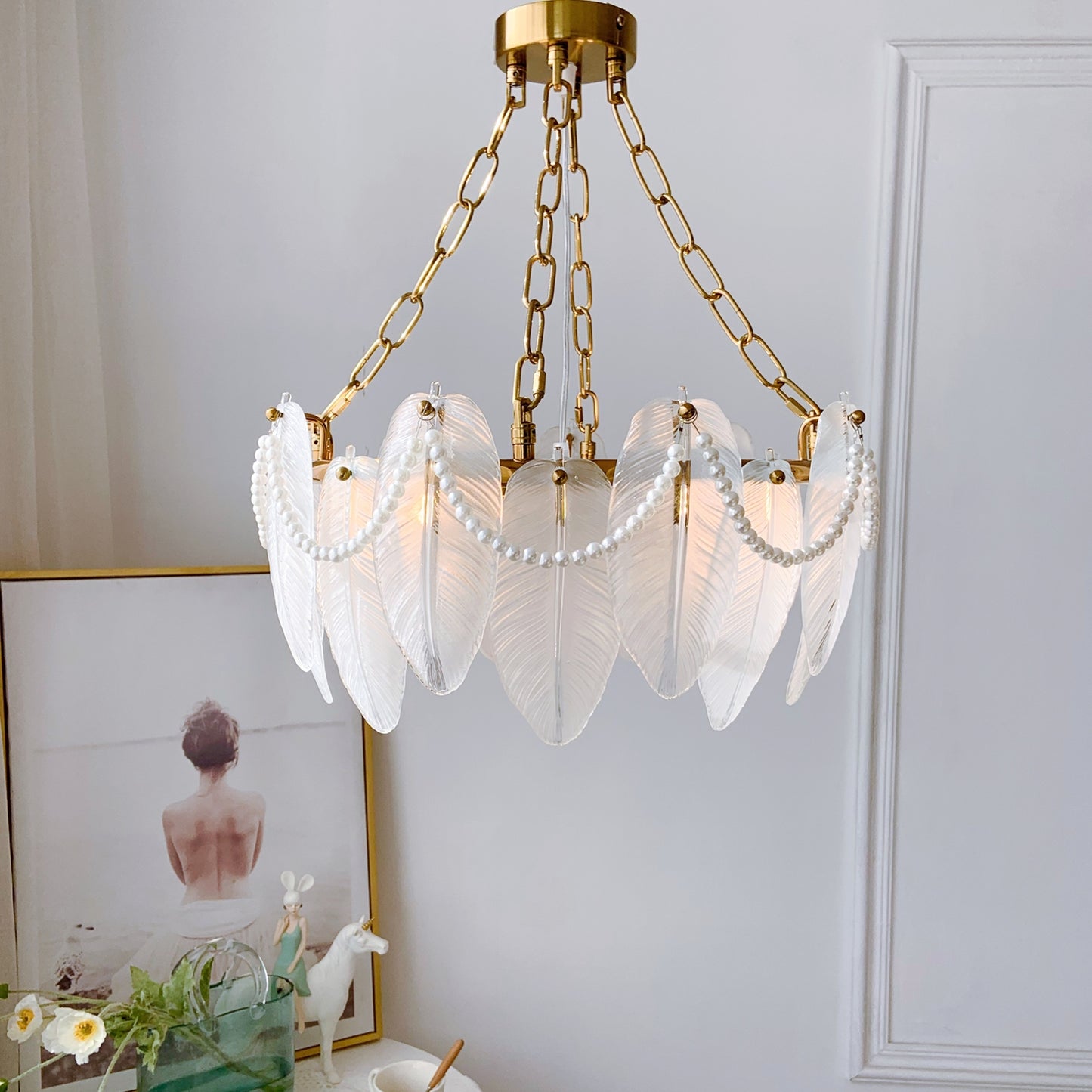 Gold chandelier with leaf-like design against