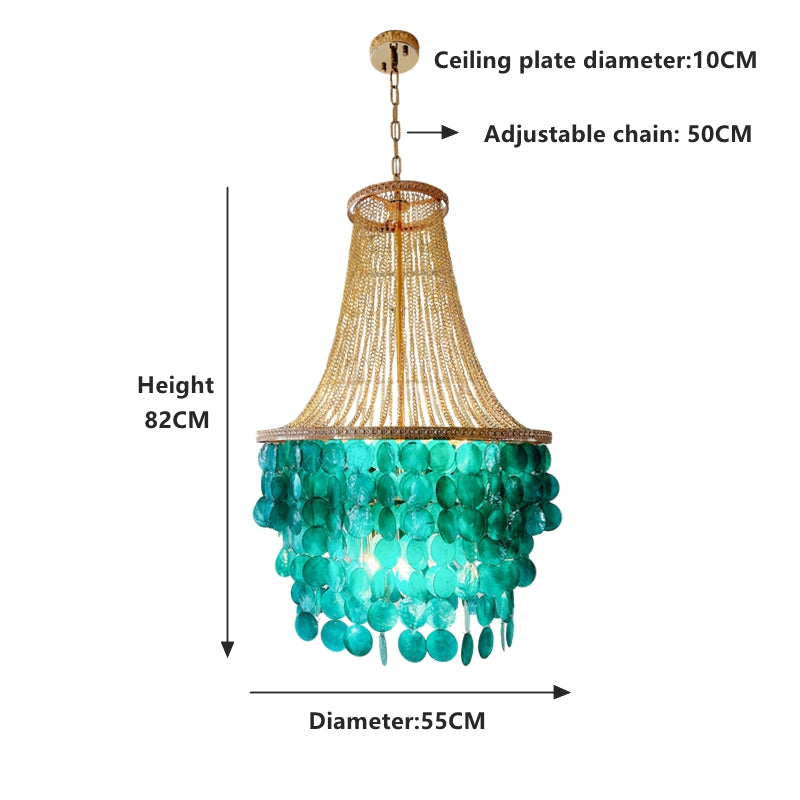 8 light chandelier creating elegant ambiance over large dining table in beach house