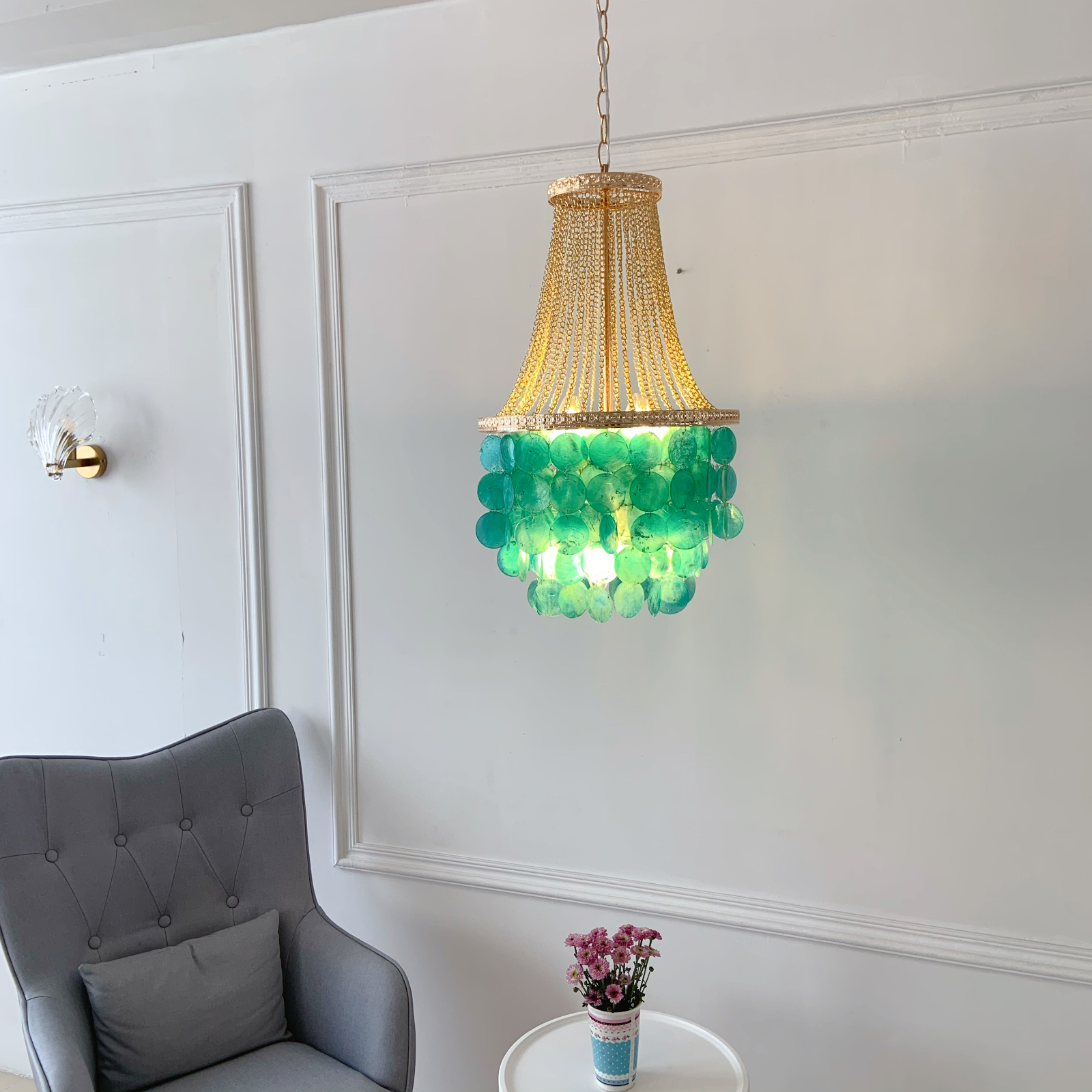 Handcrafted capiz shell chandelier with cascading tiers and ocean blue shells