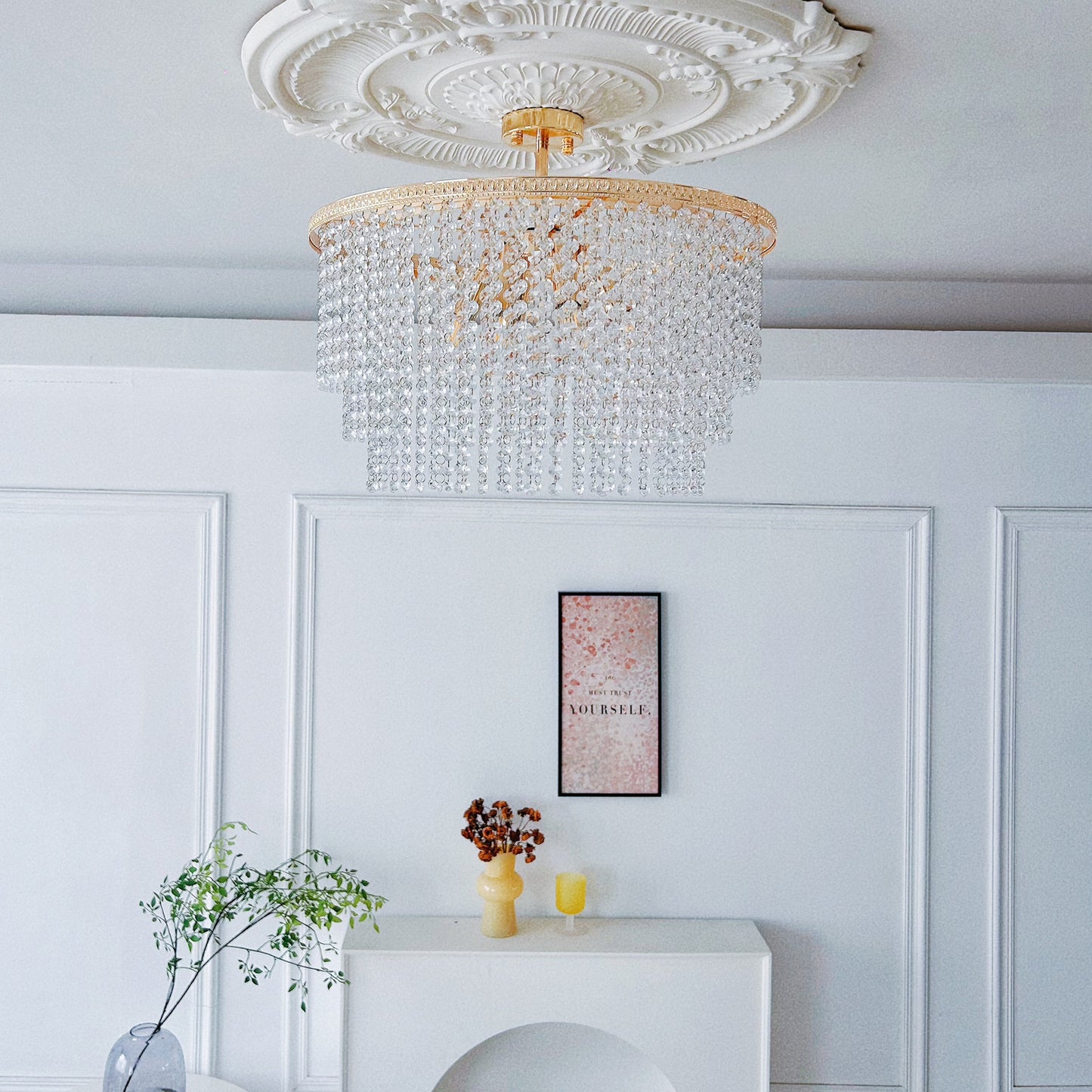 6 light crystal chandelier close up showing warm gold finish and premium crystals