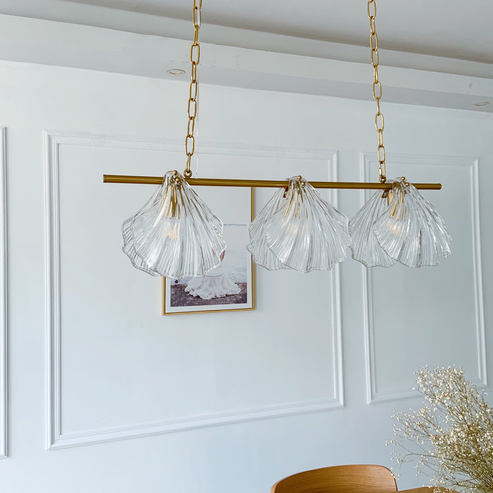 Chandelier with clear glass shades and gold chains