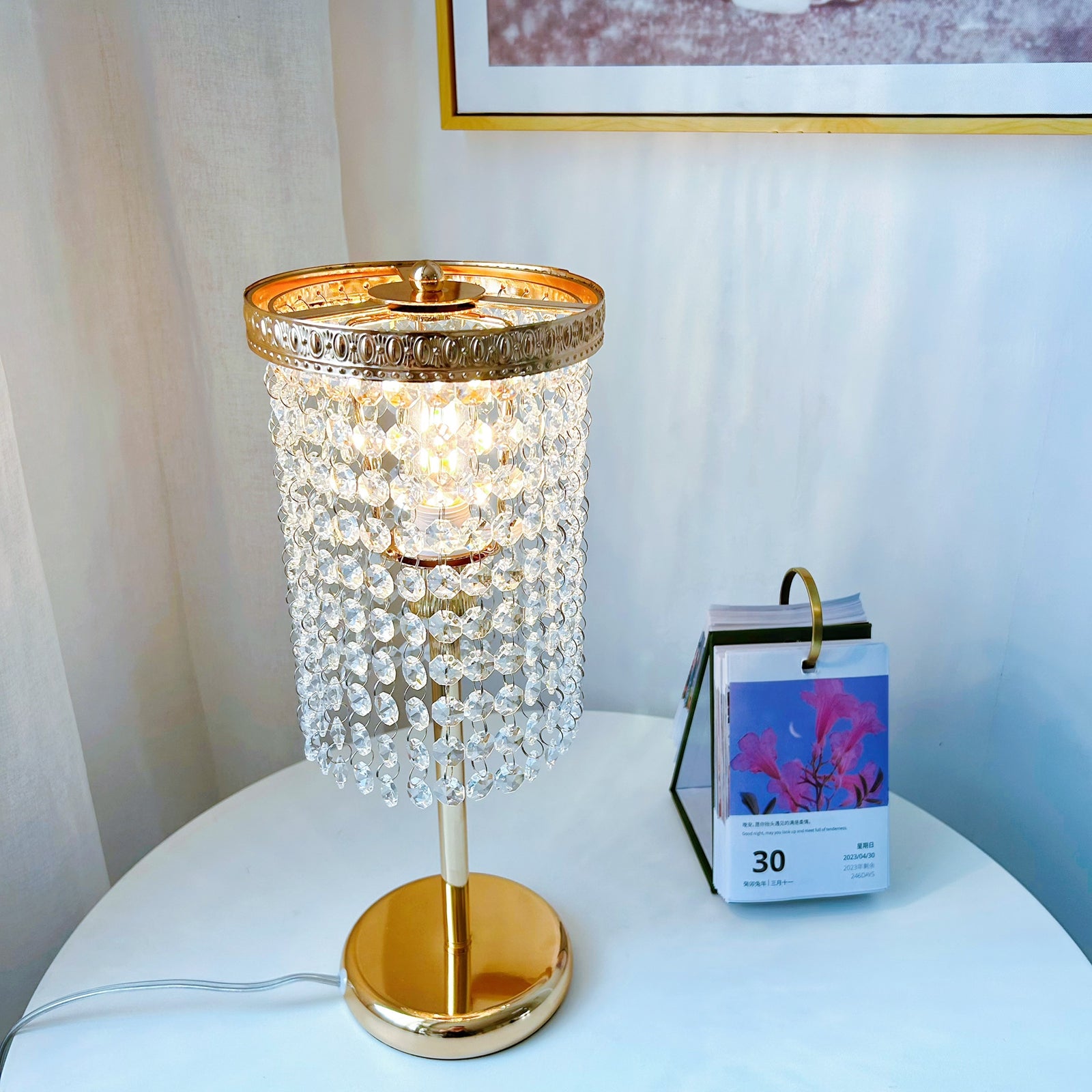 Luxury gold bedside lamp with sparkling crystal accents on nightstand