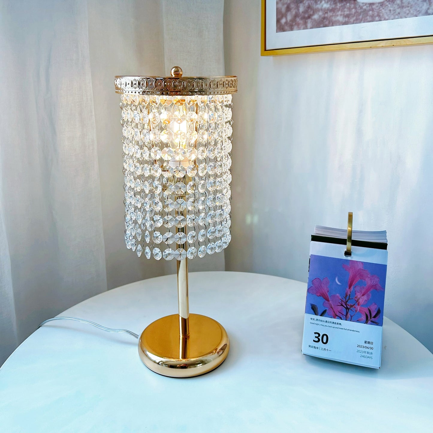 Luxury gold bedside lamp with sparkling crystal accents on nightstand