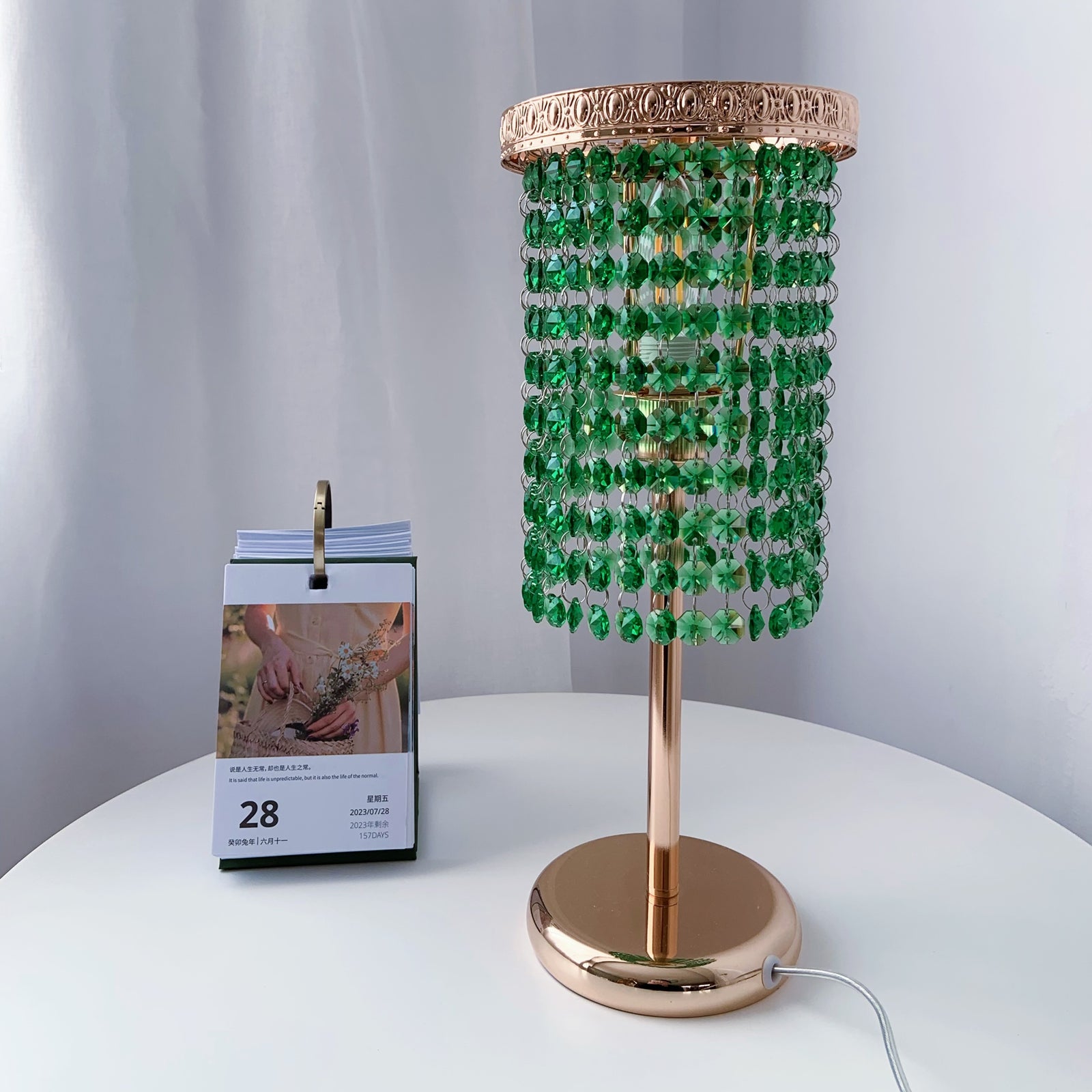 Decorative table lamp with green beaded shade