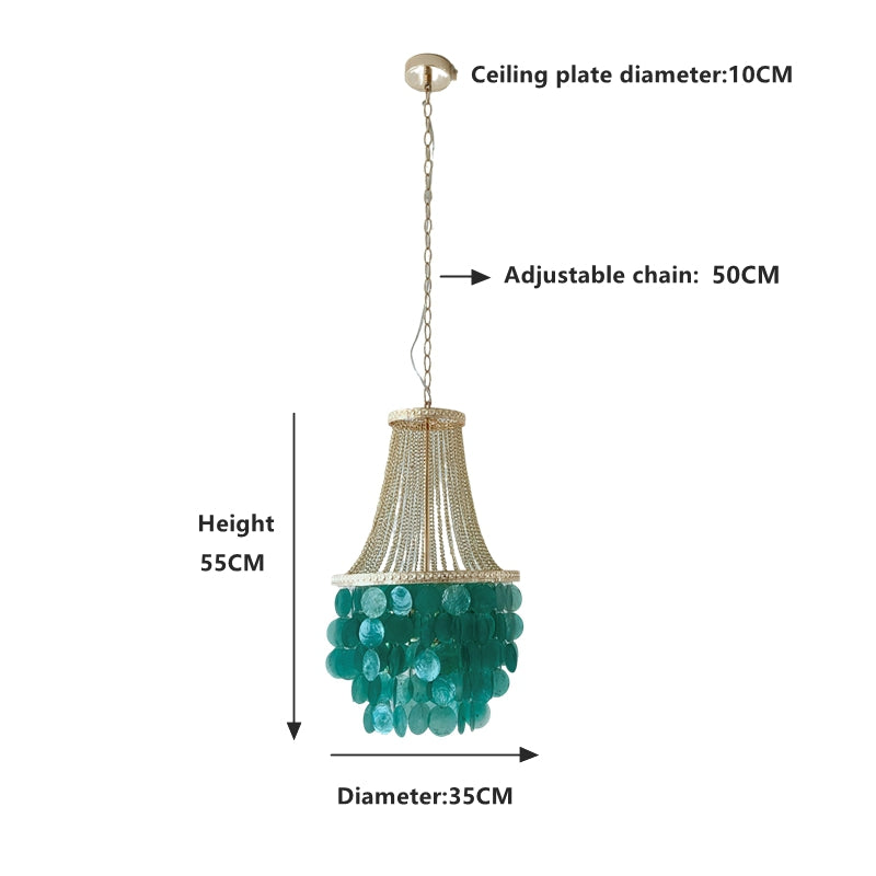 8 light shell chandelier hanging over kitchen island creating warm ambient lighting
