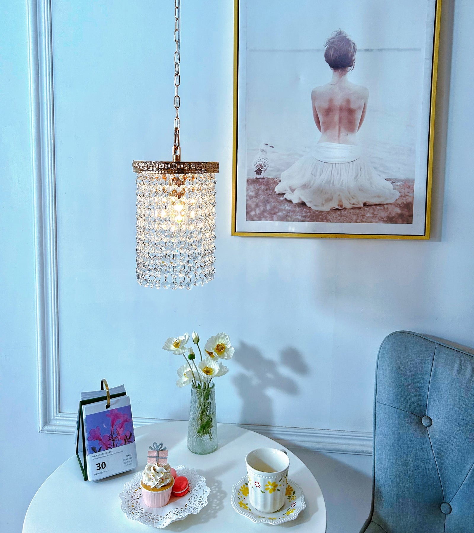 Compact crystal pendant light perfect for clustering over kitchen island or dining table