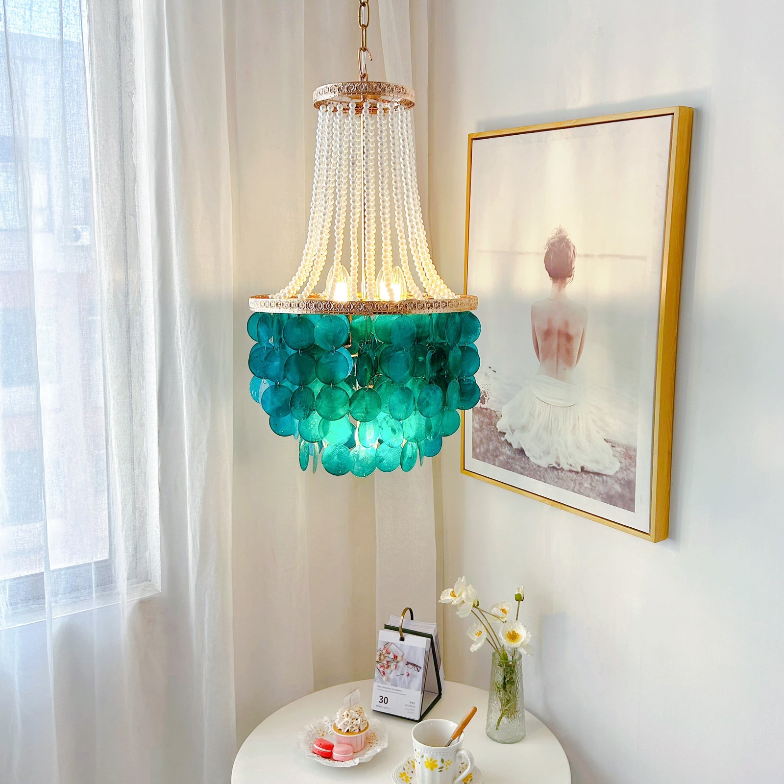 Luxury coastal chandelier with blue mother of pearl shells and French gold finish