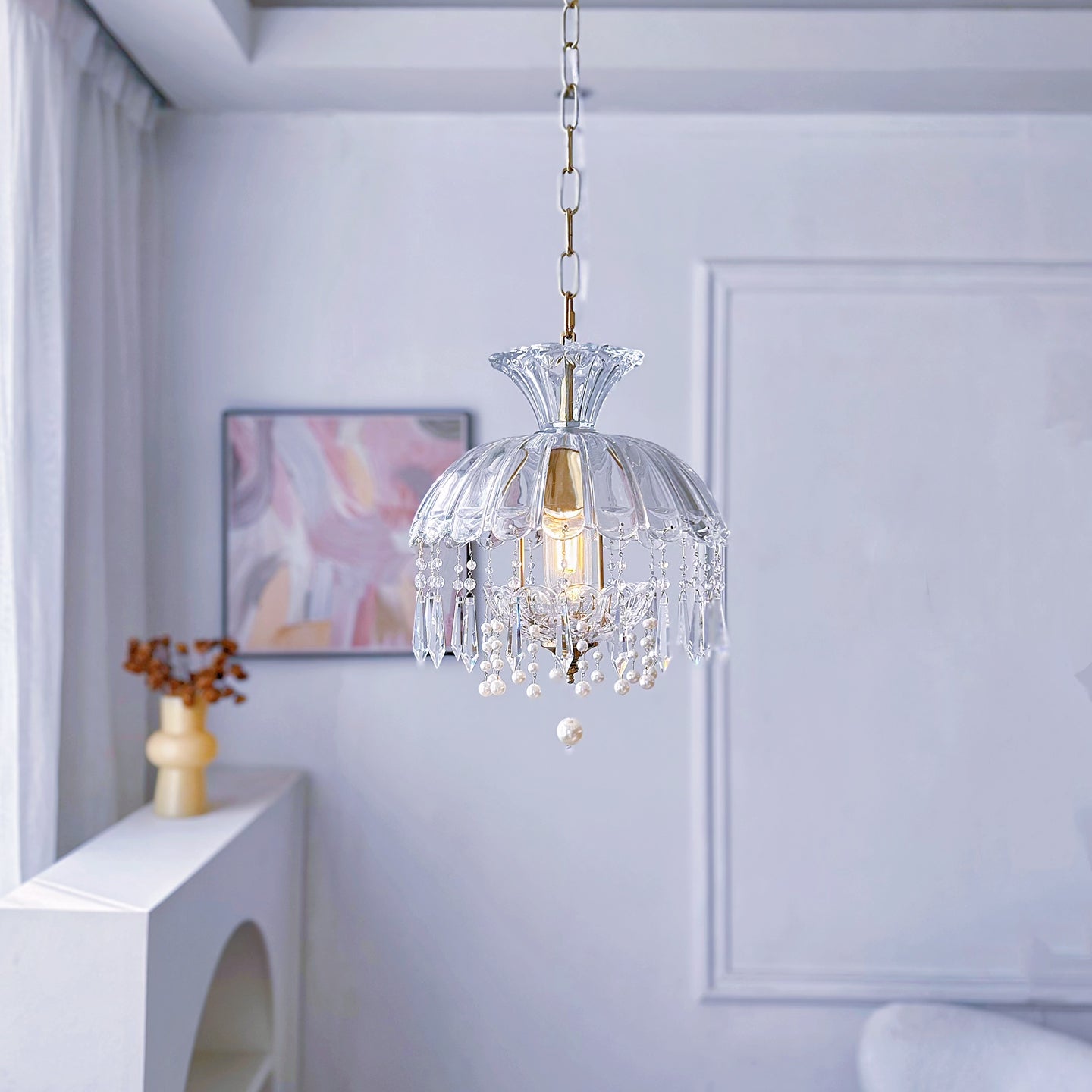 Luxury mini chandelier with brass finish and crystal accents creating elegant ambiance