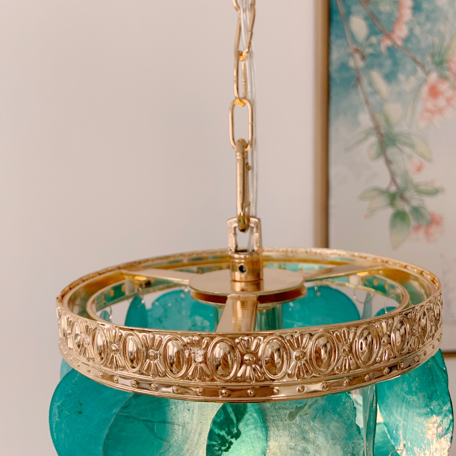 Modern coffee pendant light close up showing natural mother of pearl shell details