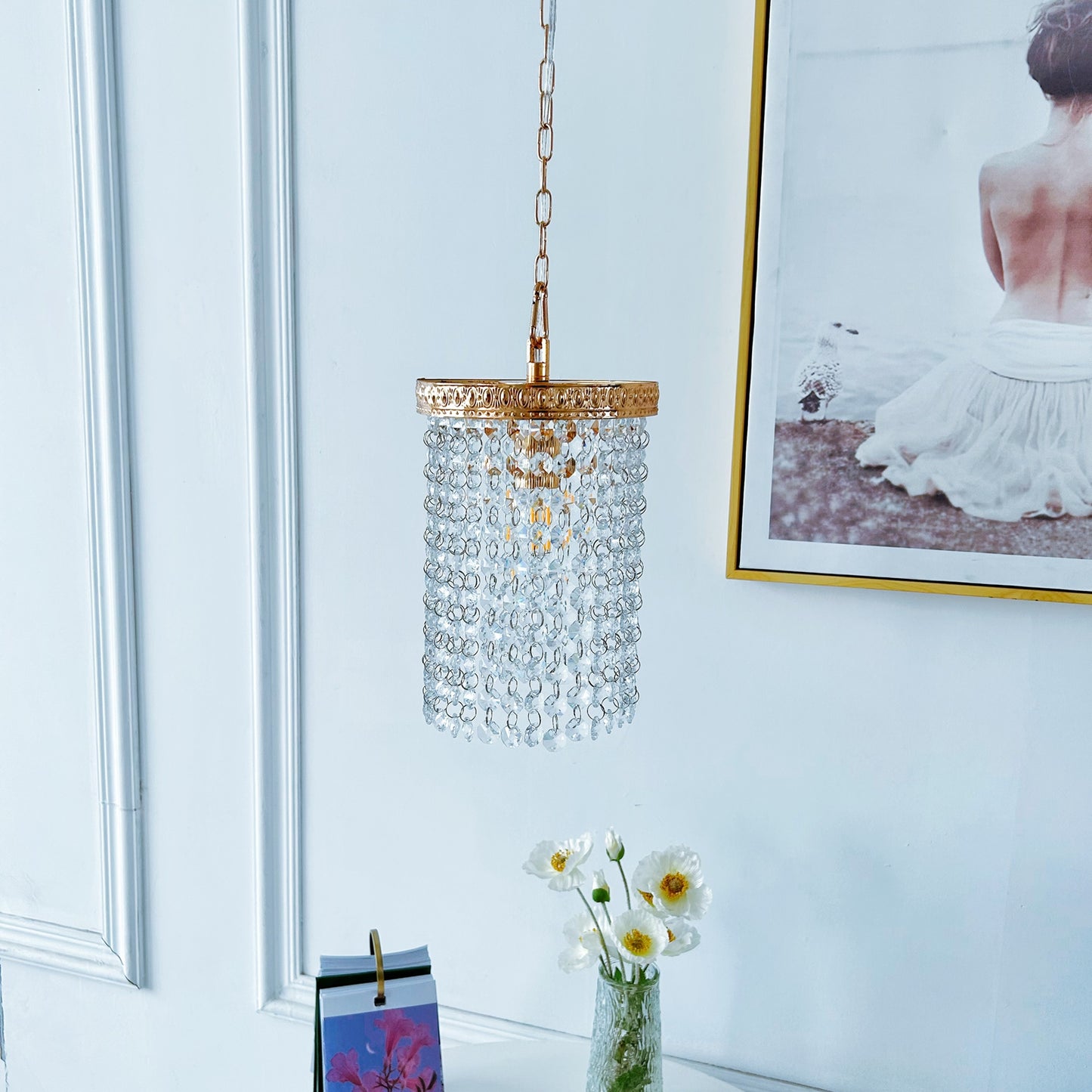 Gold crystal hanging light close up showing warm finish and premium crystal details