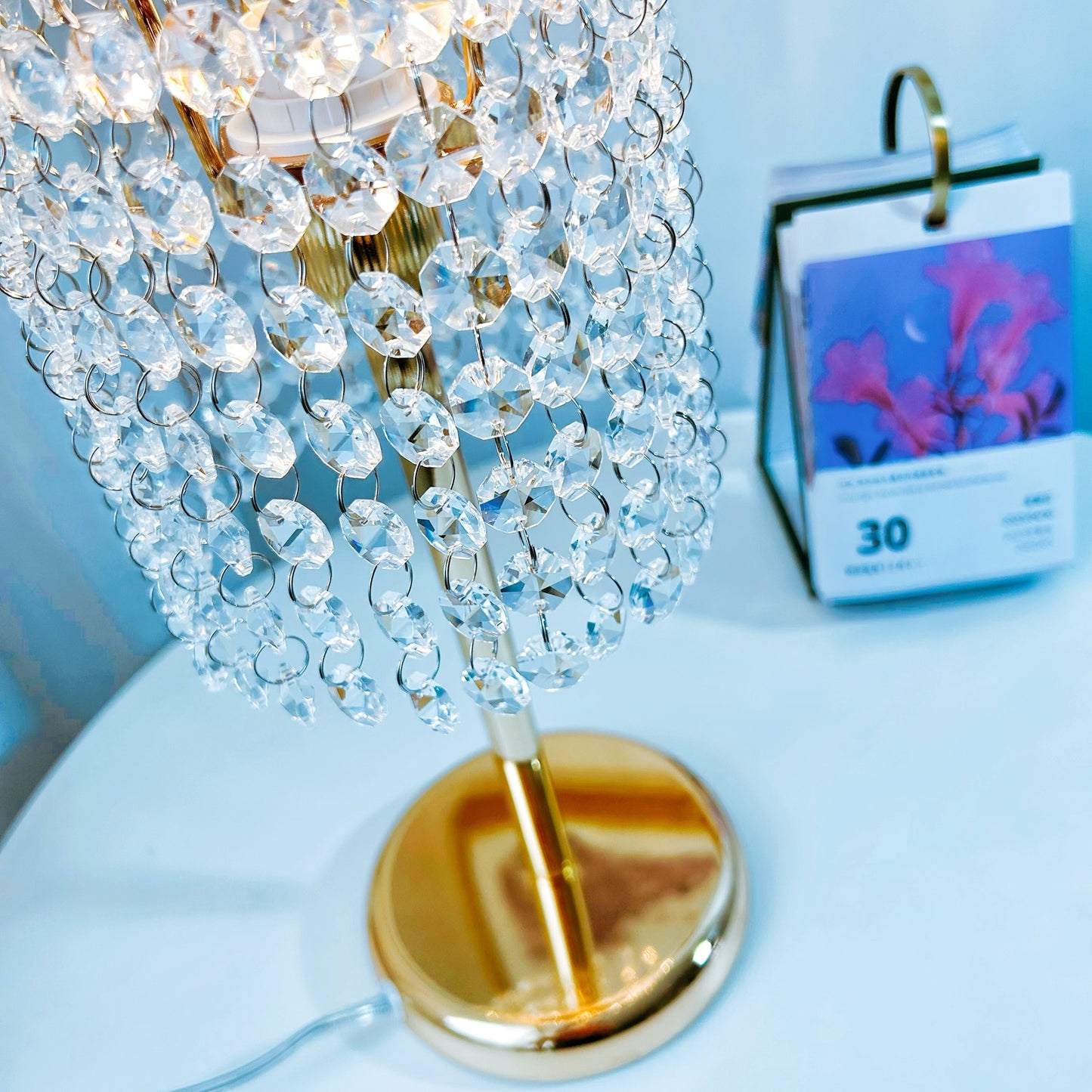 Elegant gold crystal lamp close up showing premium finish and decorative details