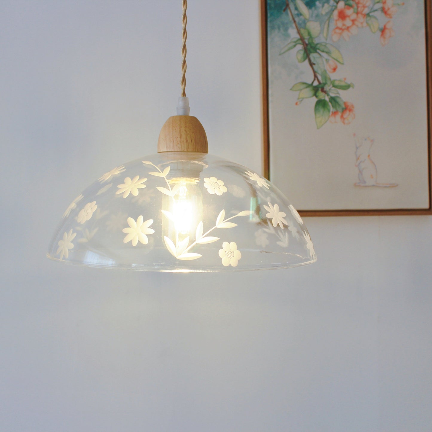 Minimalist clear glass pendant with brass hardware perfect for dining room and entryway