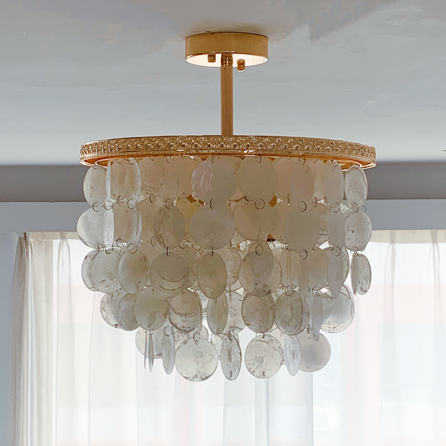 Compact capiz shell semi flush mount with French gold finish for low ceiling bedroom