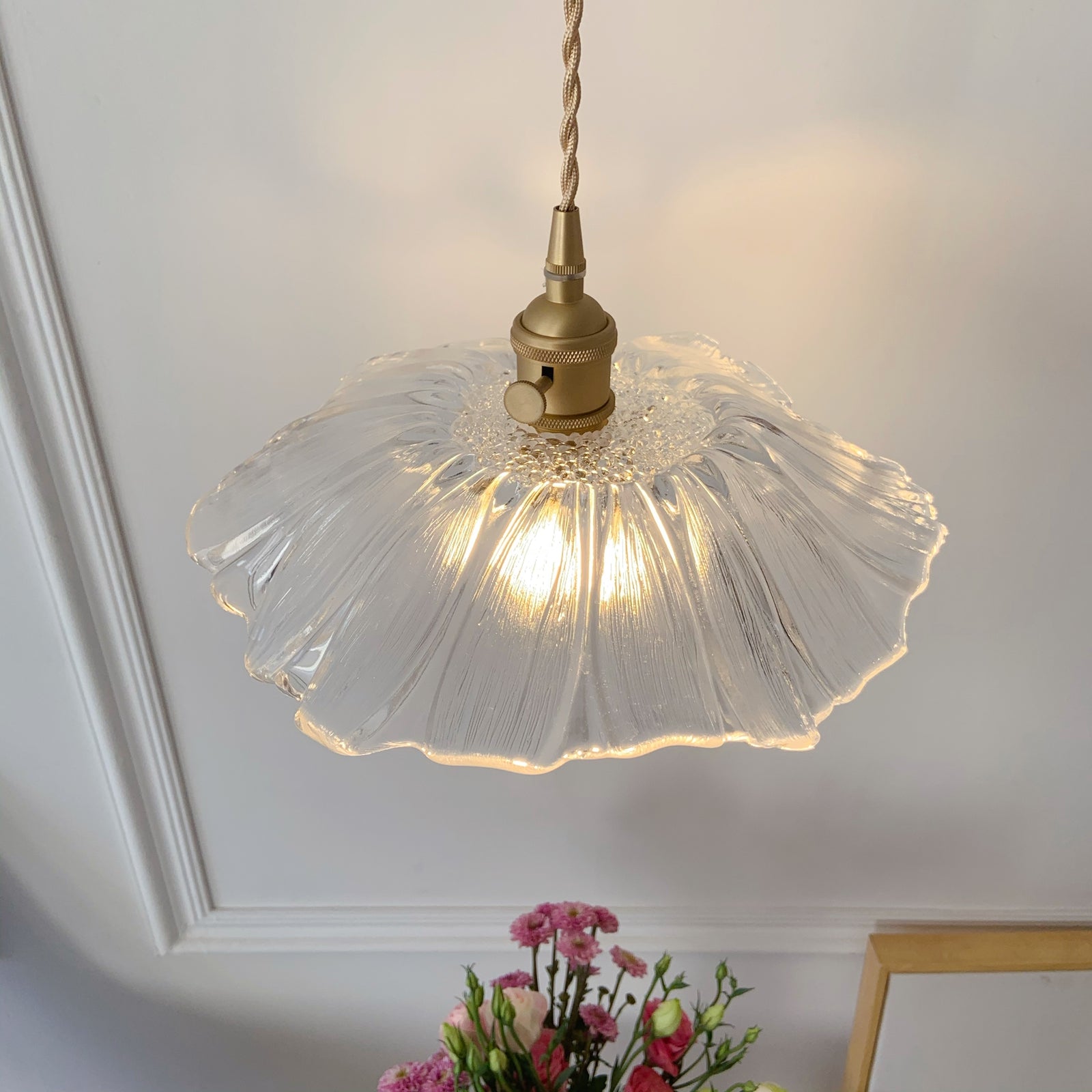 Single glass pendant light with brass hardware perfect for kitchen and cafe style decor