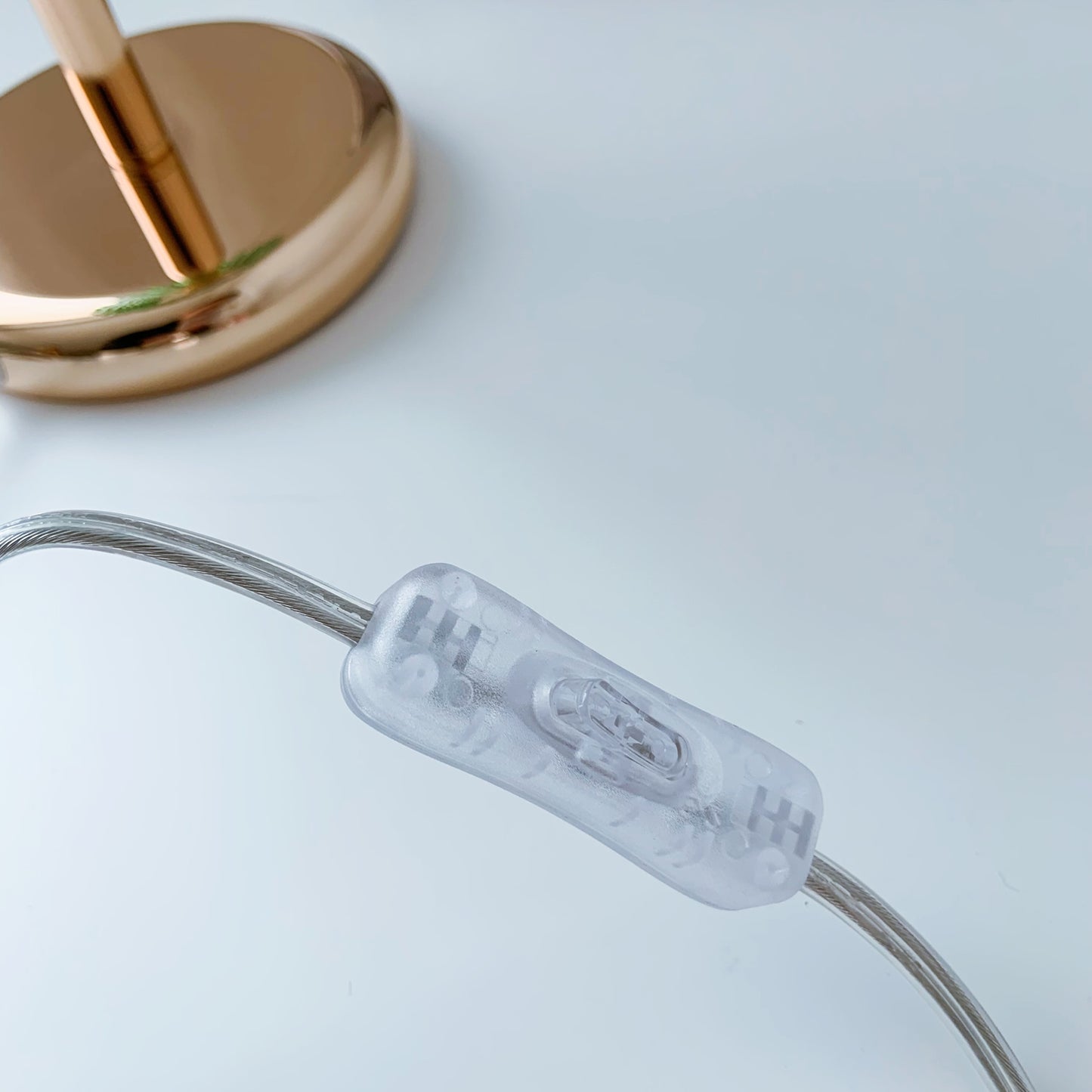 Clear cable tie with branding on a light