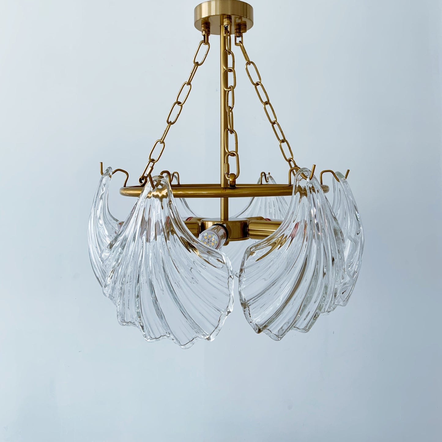 Gold chandelier with clear glass shades