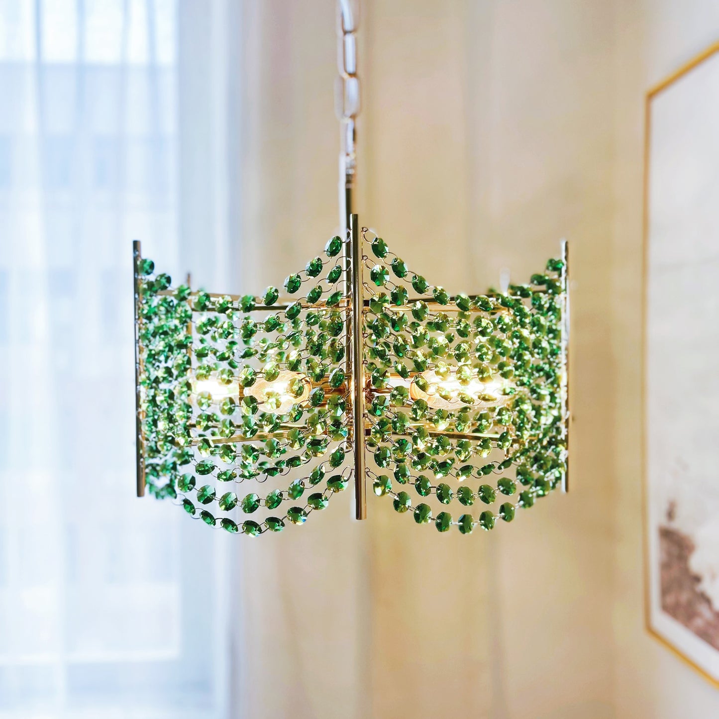 Chandelier with green gemstones in a room setting