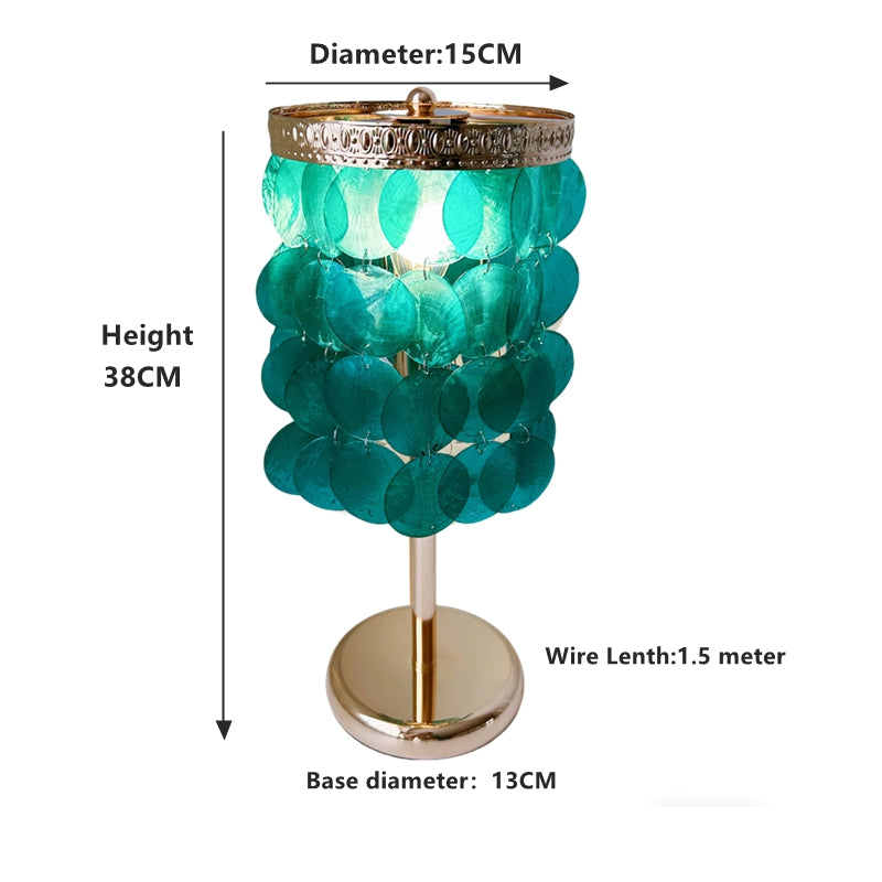 Mother of pearl table lamp close up showing blue shell details and handcrafted quality