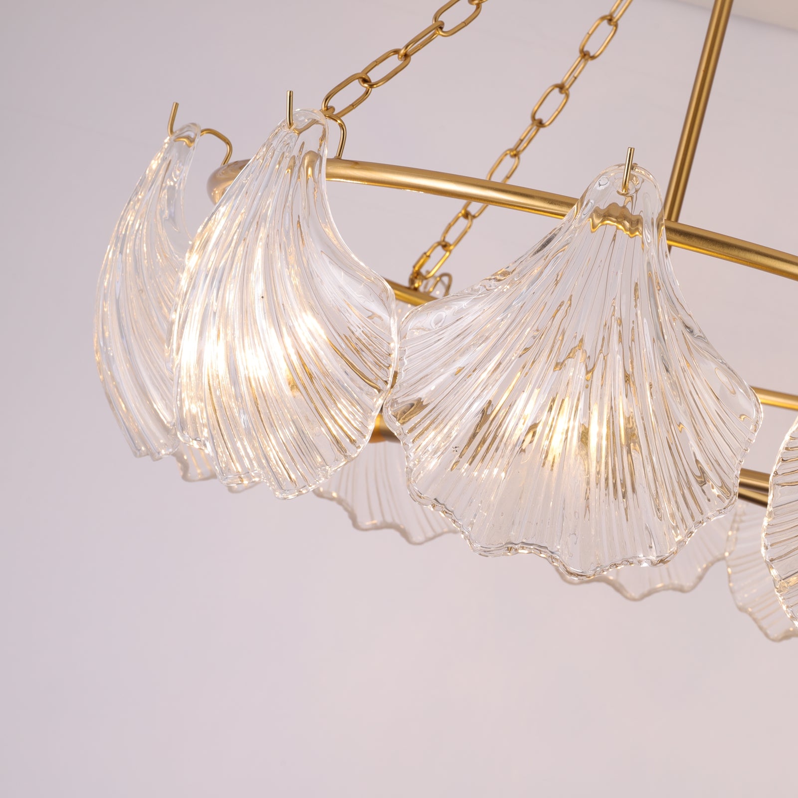 Chandelier with clear glass shades and gold metal accents