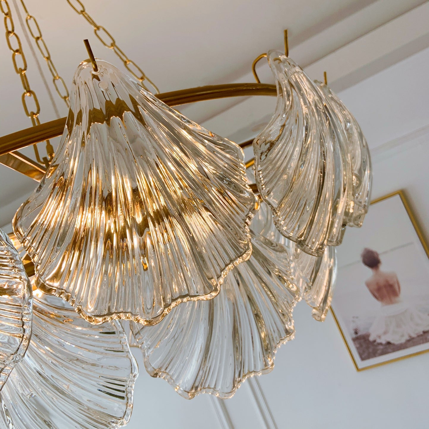 Chandelier with glass shades and gold accents