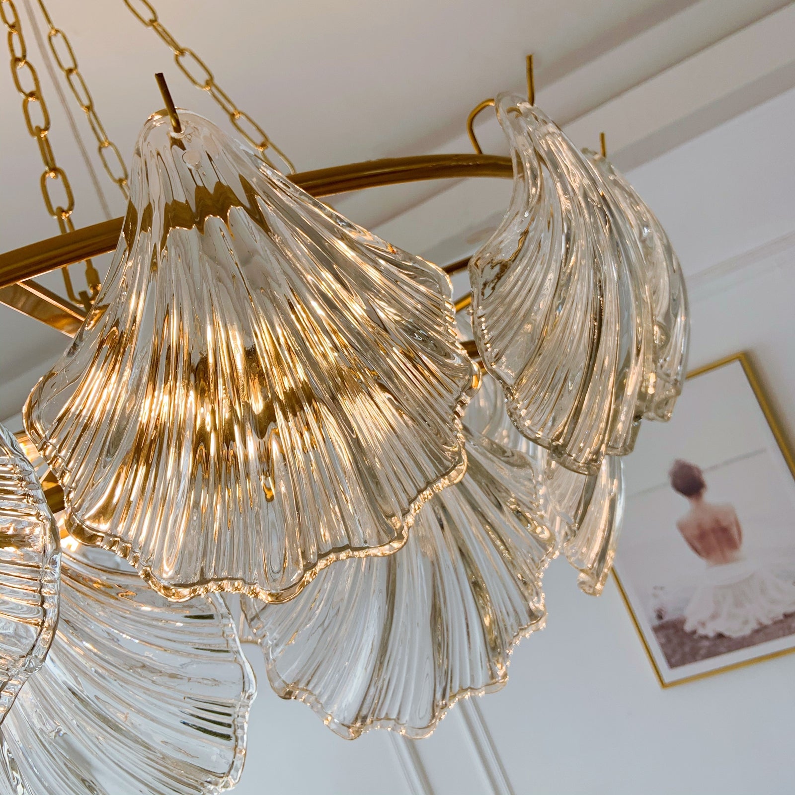 Chandelier with glass shades and gold accents