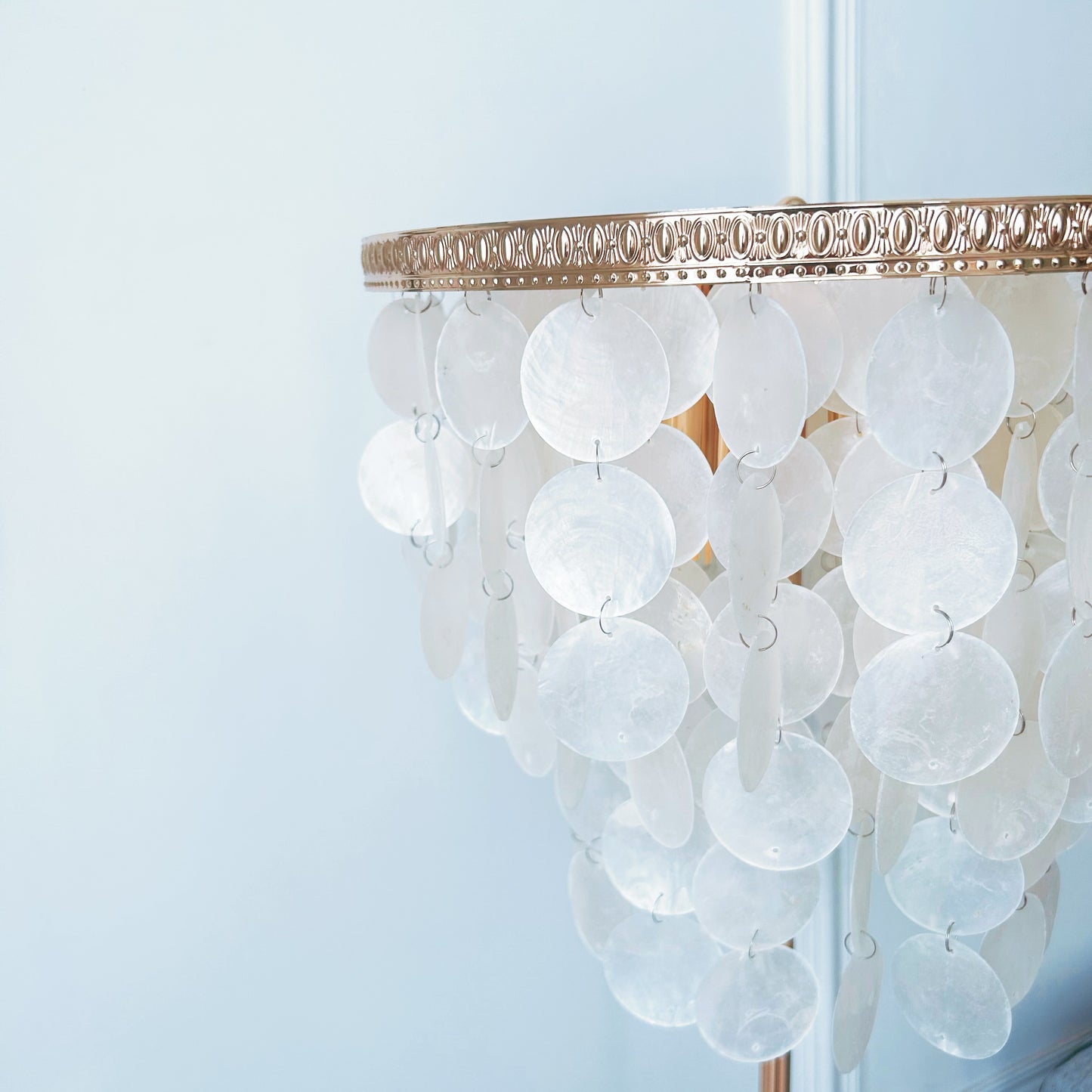 Chandelier with white circular beads and gold trim