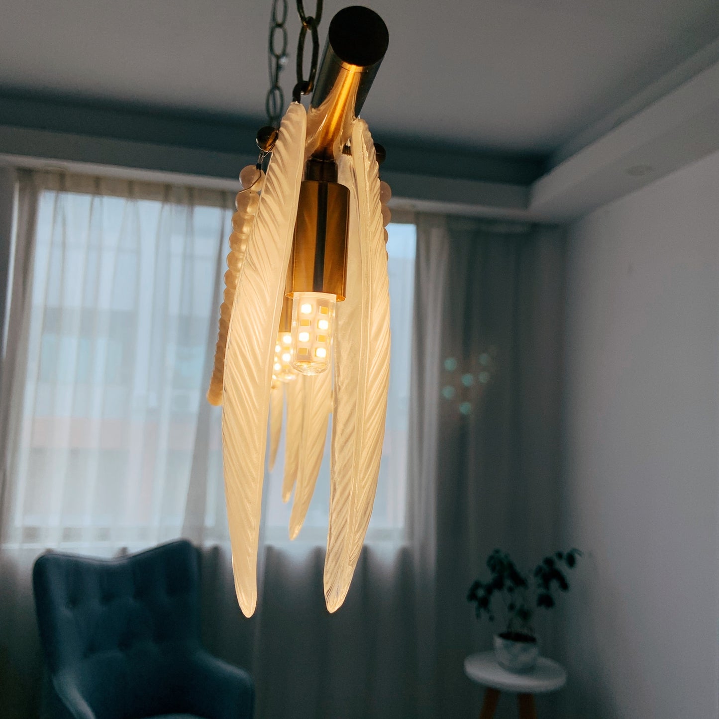Decorative ceiling light fixture with wing-like design