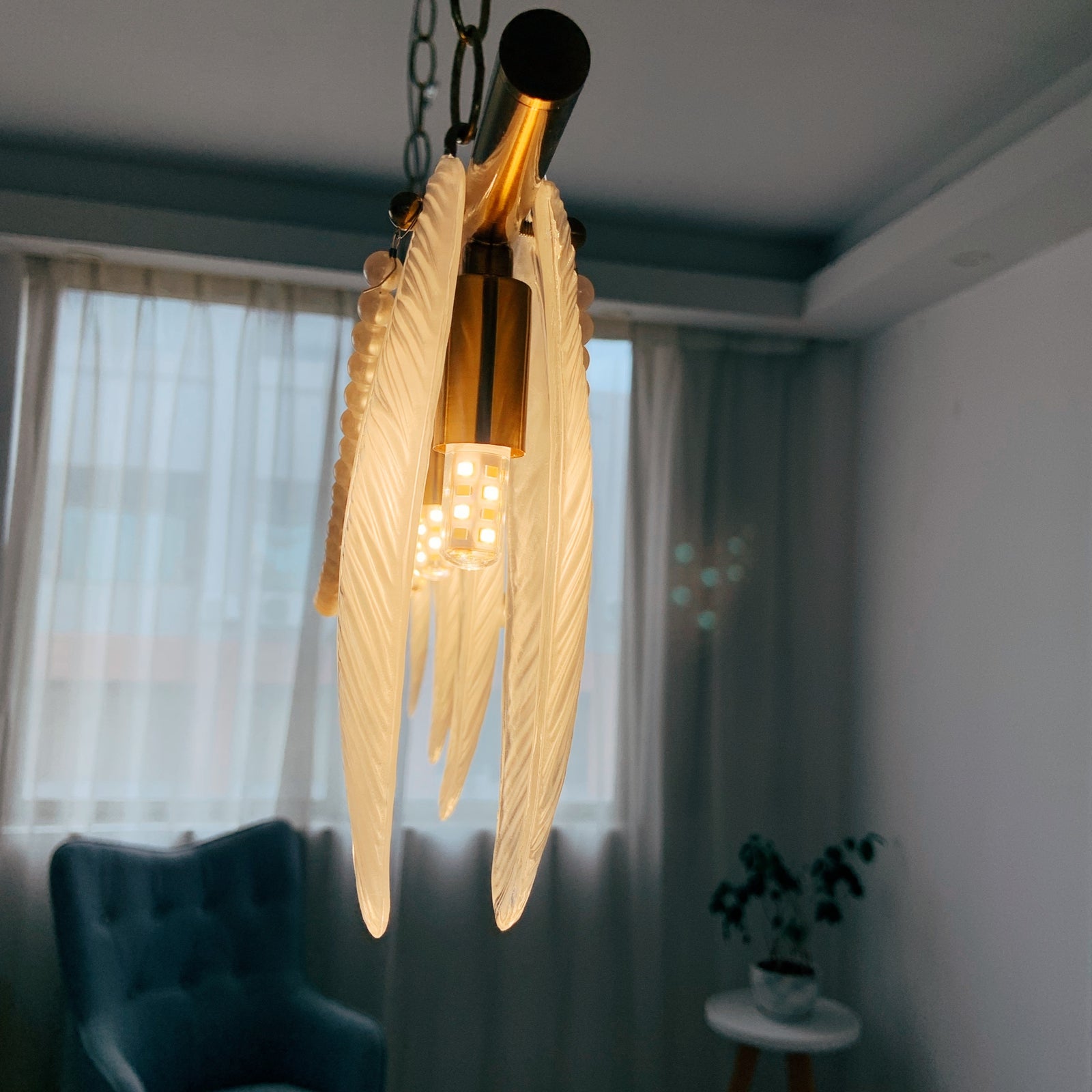 Decorative ceiling light fixture with wing-like design
