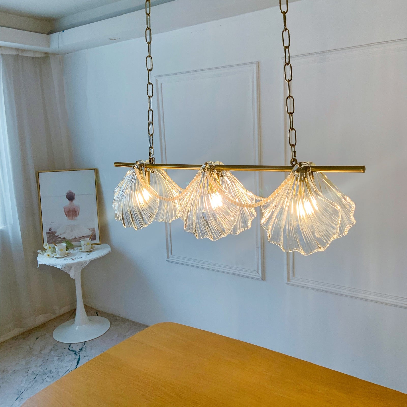 Modern chandelier with glass shades in a room setting