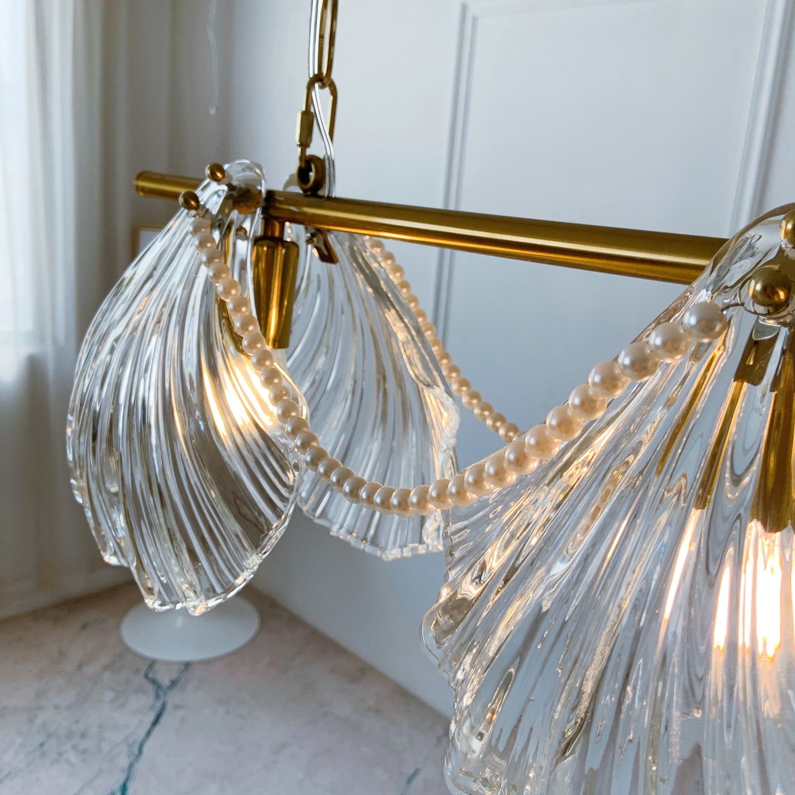 Chandelier with clear glass shades and gold accents