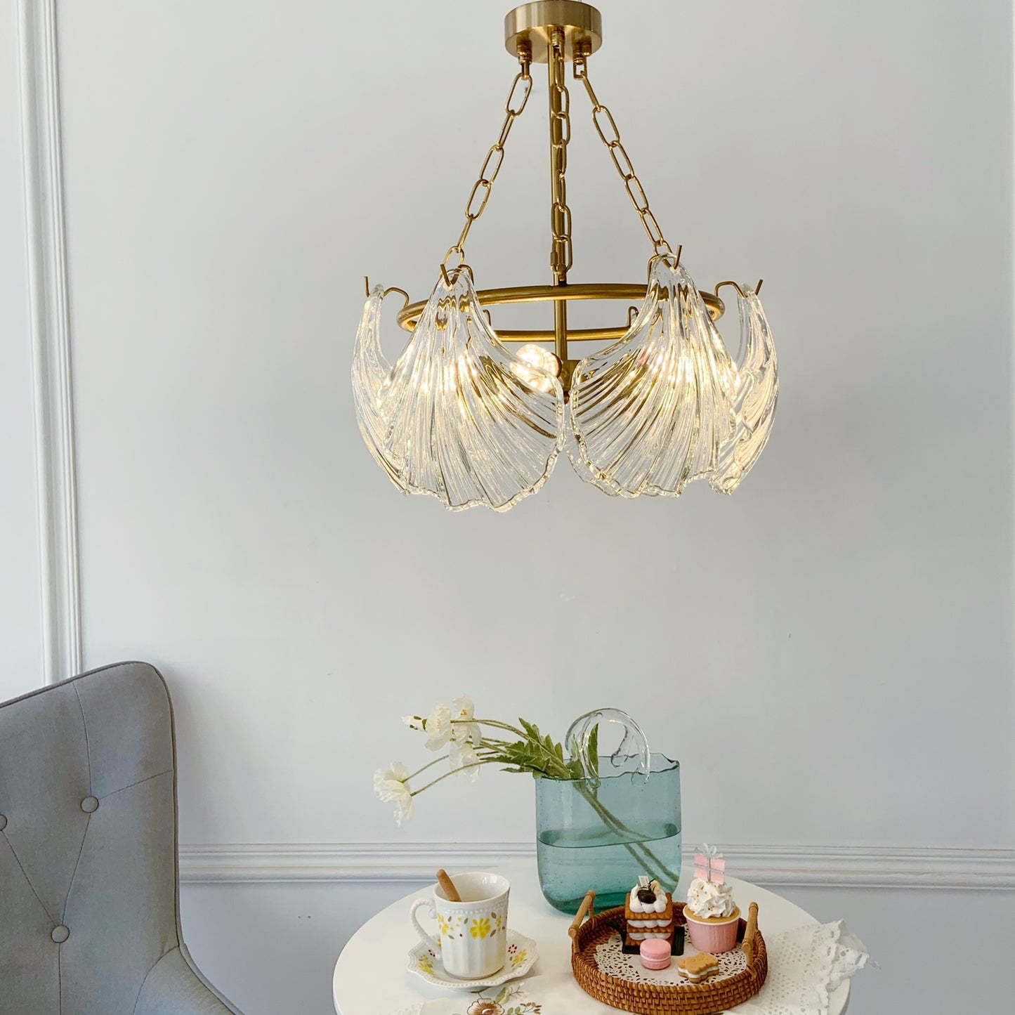 Gold chandelier hanging above a table